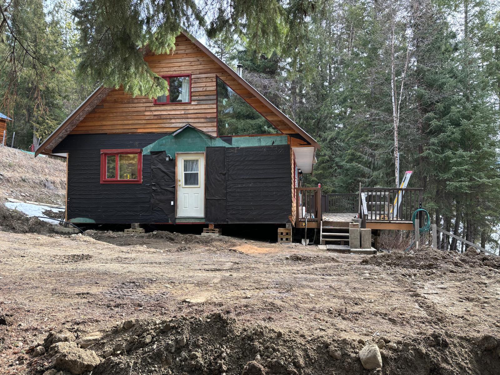 Original cabin before the addition, with site preparation underway